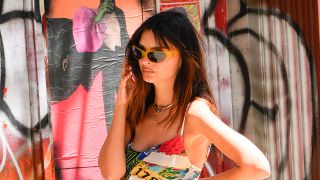 Emily Ratajkowski man on the street photo near a cool graffiti wall. 