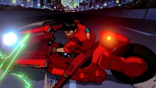 A man on a red motorbike during one of the best sci-fi movies ever made, Akira.