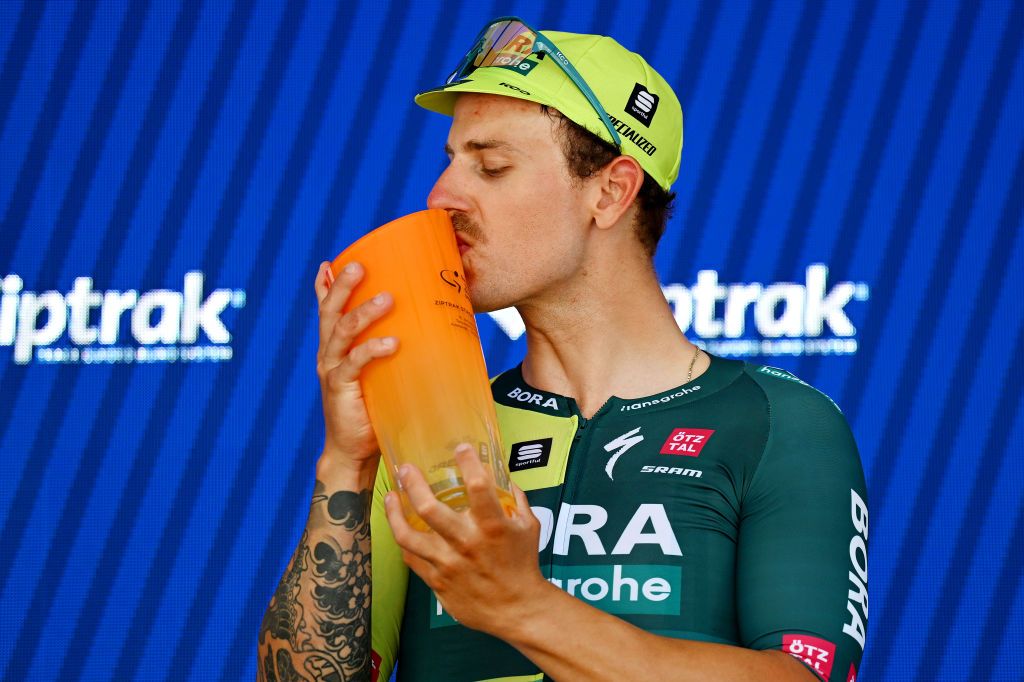 Sam Welsford (BORA-Hansgrohe) celebrates on the podium