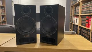 Pair of PMC Prodigy 1 speakers on a rack