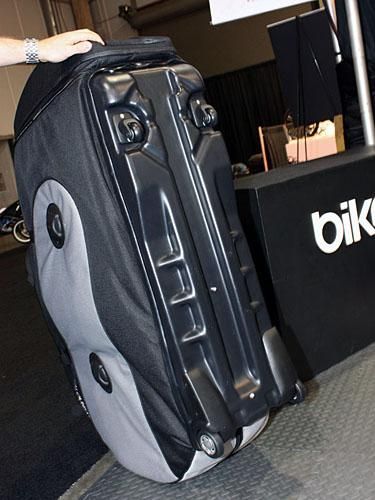 The whole bag rolls on a rigid plastic base with four easy-rolling casters.