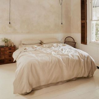 Oatmeal & White Bedding Bundle on a bed.
