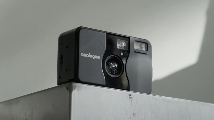Analogue aF-1 point-and-shoot film camera on a grey block