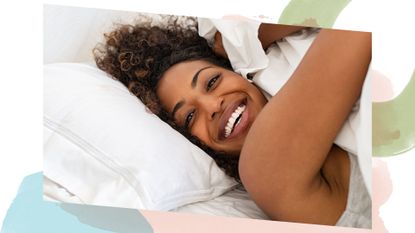A woman smiling in bed with great skin after following a skincare night routine 