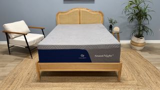 The SweetNight CoolNest Mattress on a wooden bed frame in a neutral-colored modern bedroom setting.