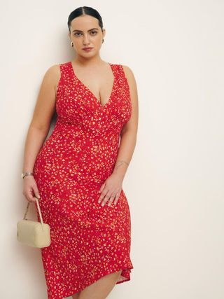 Model wears red Reformation, Beauden Dress Es