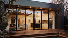 wooden decking surrounding a glass extension