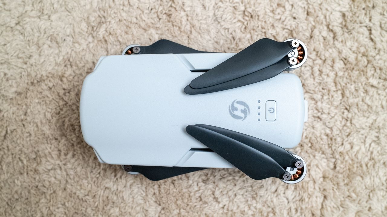 Holy Stone HS360E on a beige carpet