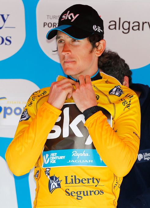 Geraint Thomas pulls on the leader's jersey at the Volta ao Algarve