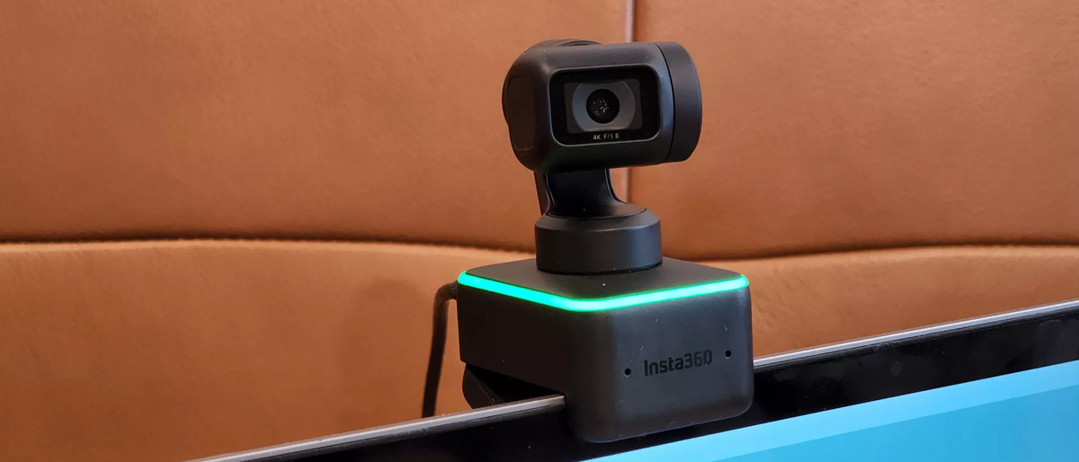 Insta360 Link mounted on MacBook Pro display.