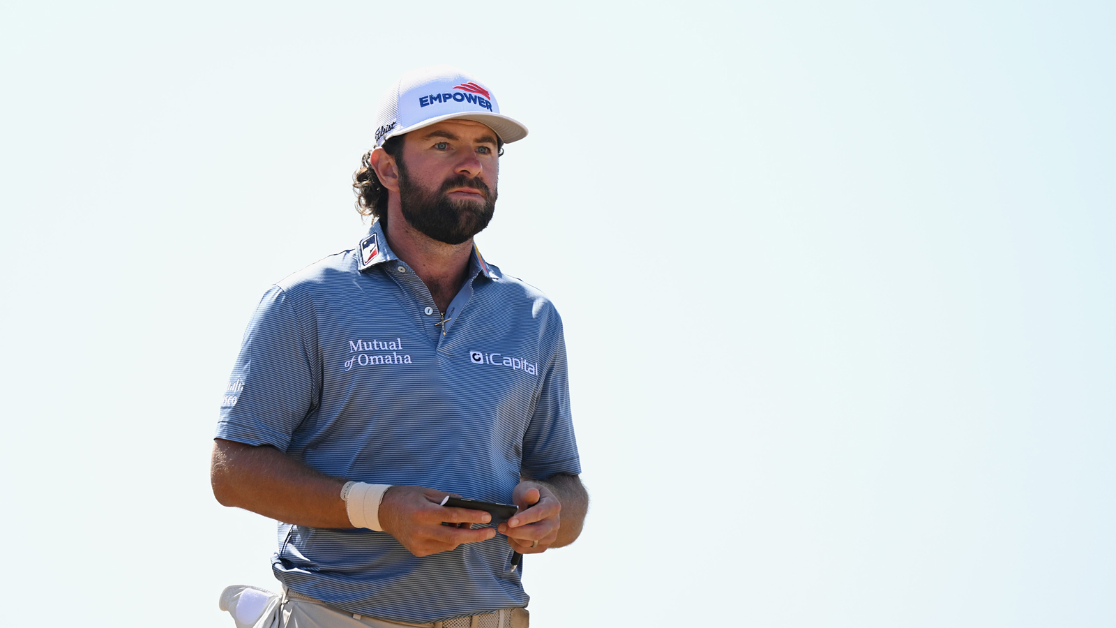 Cameron Young walks down the fairway