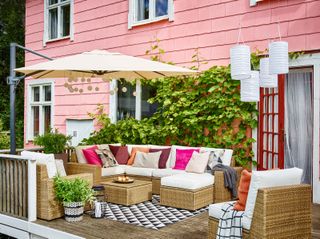 small deck ideas with cushions and corner sofa from Ikea