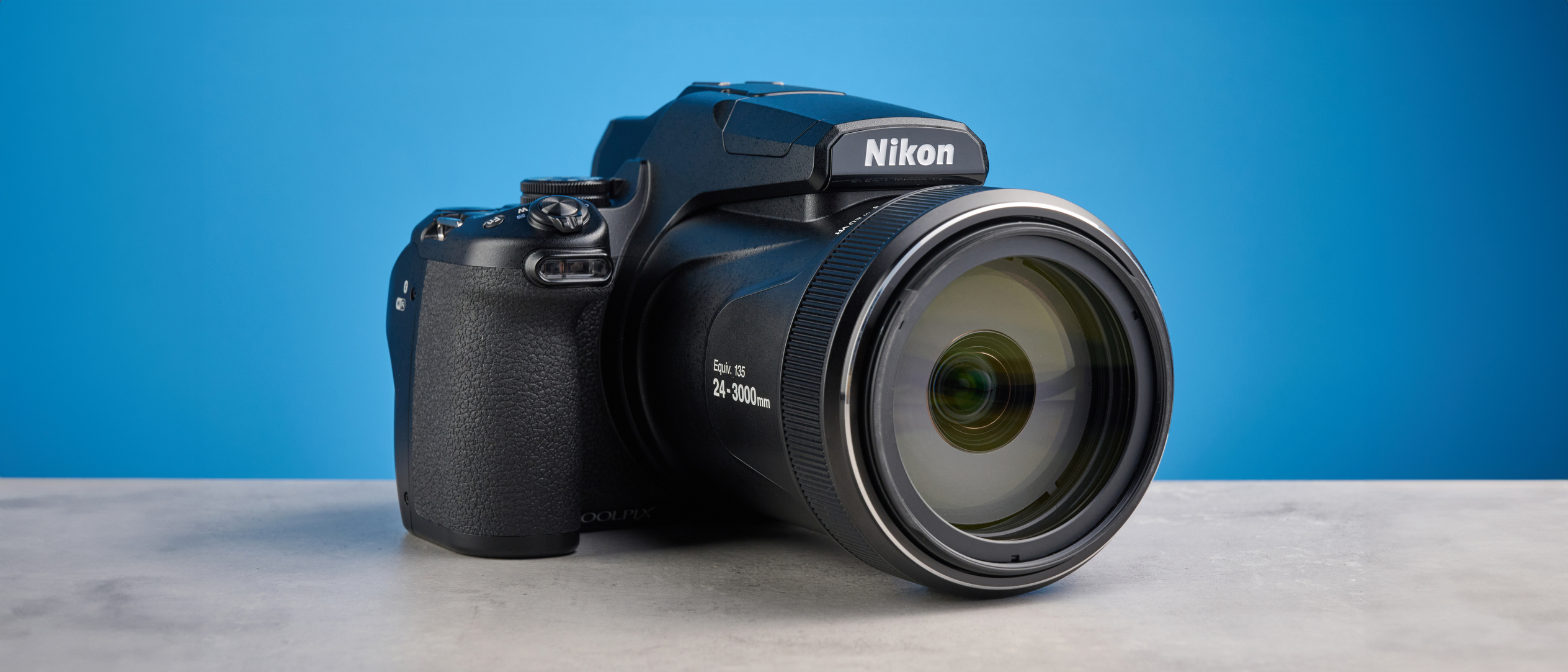 A black Nikon Coolpix P1100 digital camera