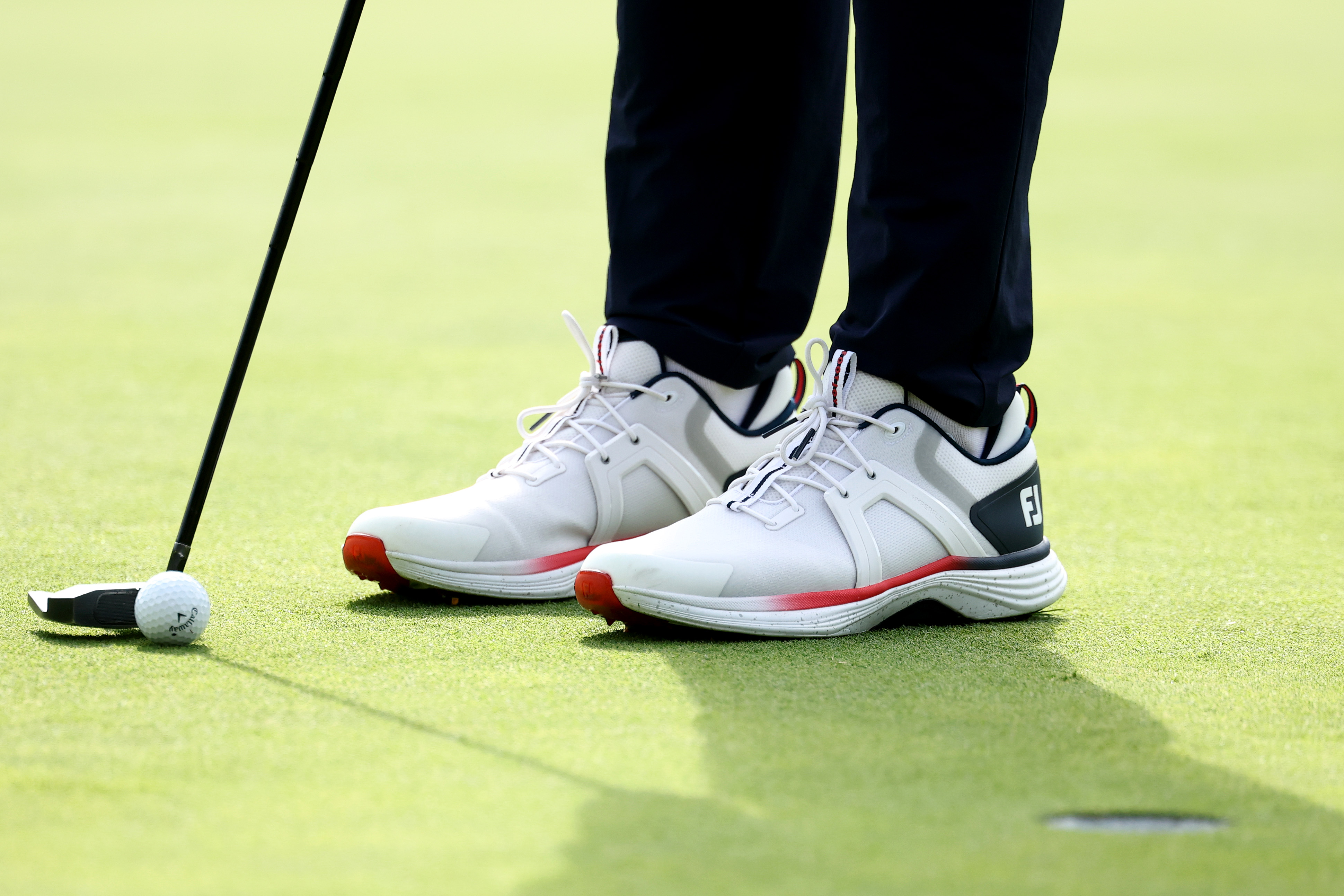 A detailed view of the shoes worn by Sam Burns of Team United States as he plays the eighth hole during the Friday afternoon four-ball matches of the 2025 Ryder Cup
