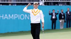 Minjee Lee of Australia pumps her fist in the air after beating Alison Lee of the United States in a playoff during the final round of the BMW Ladies Championship on the Seowon Hills course at Seowon Valley Country Club