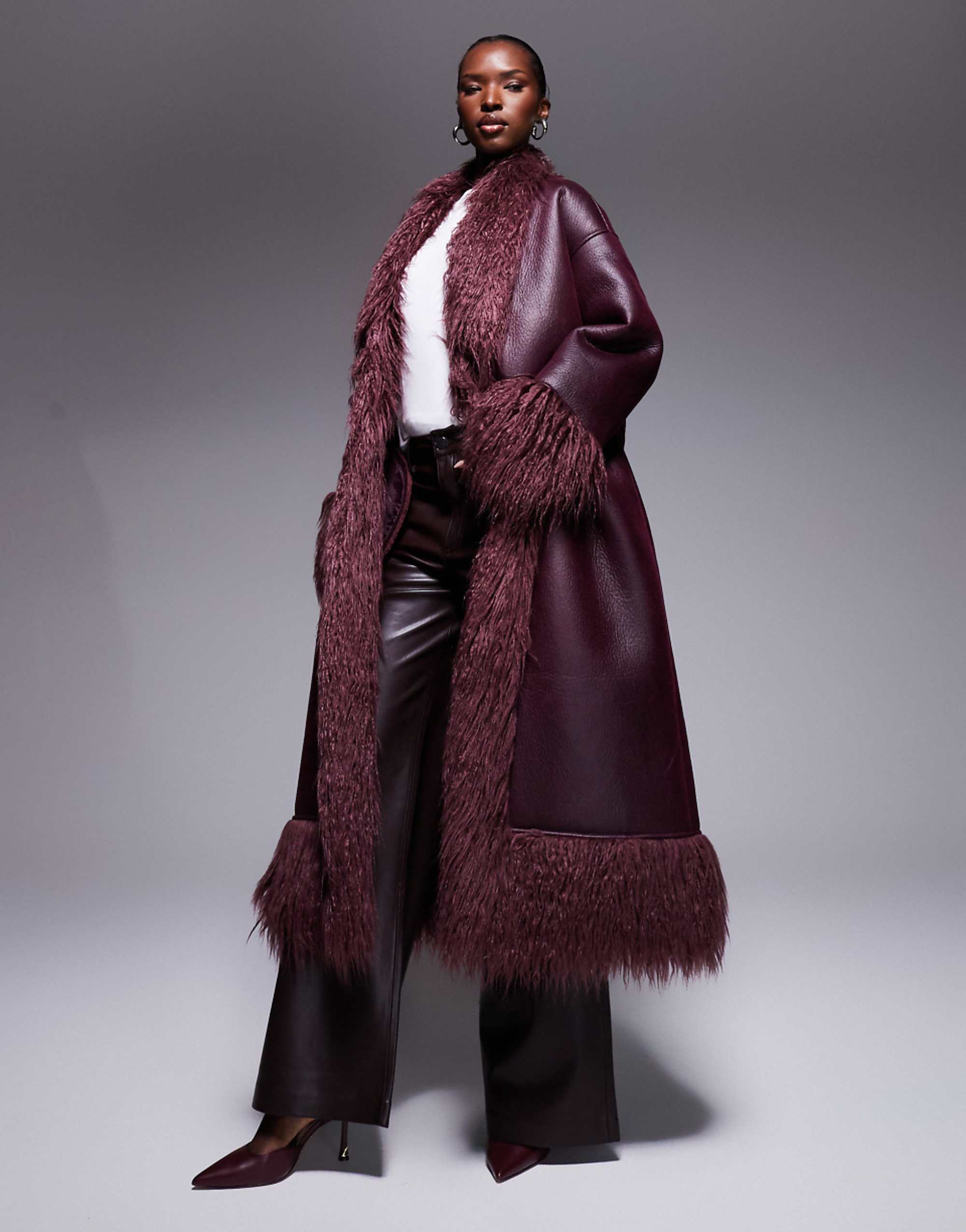 Aria Cove Shaggy Faux Fur Trim Belted Leather Look Maxi Coat in Burgundy