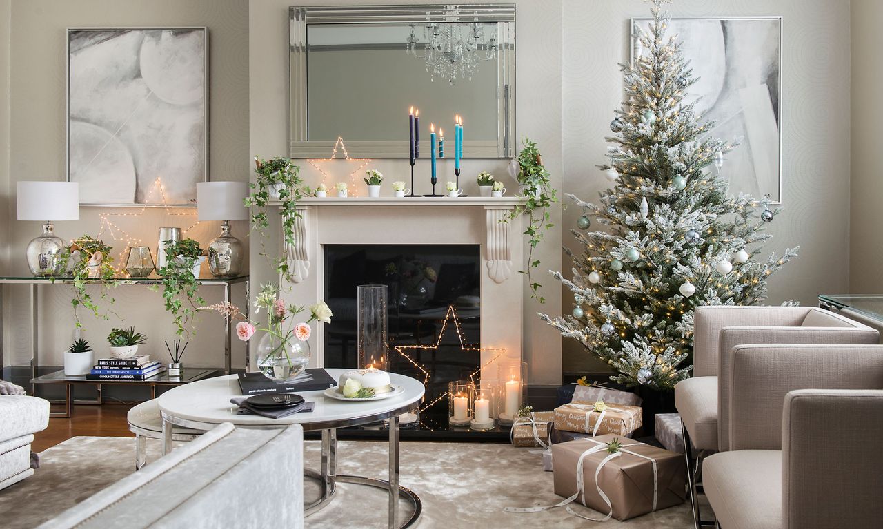 living room with christmas tree and fireplace