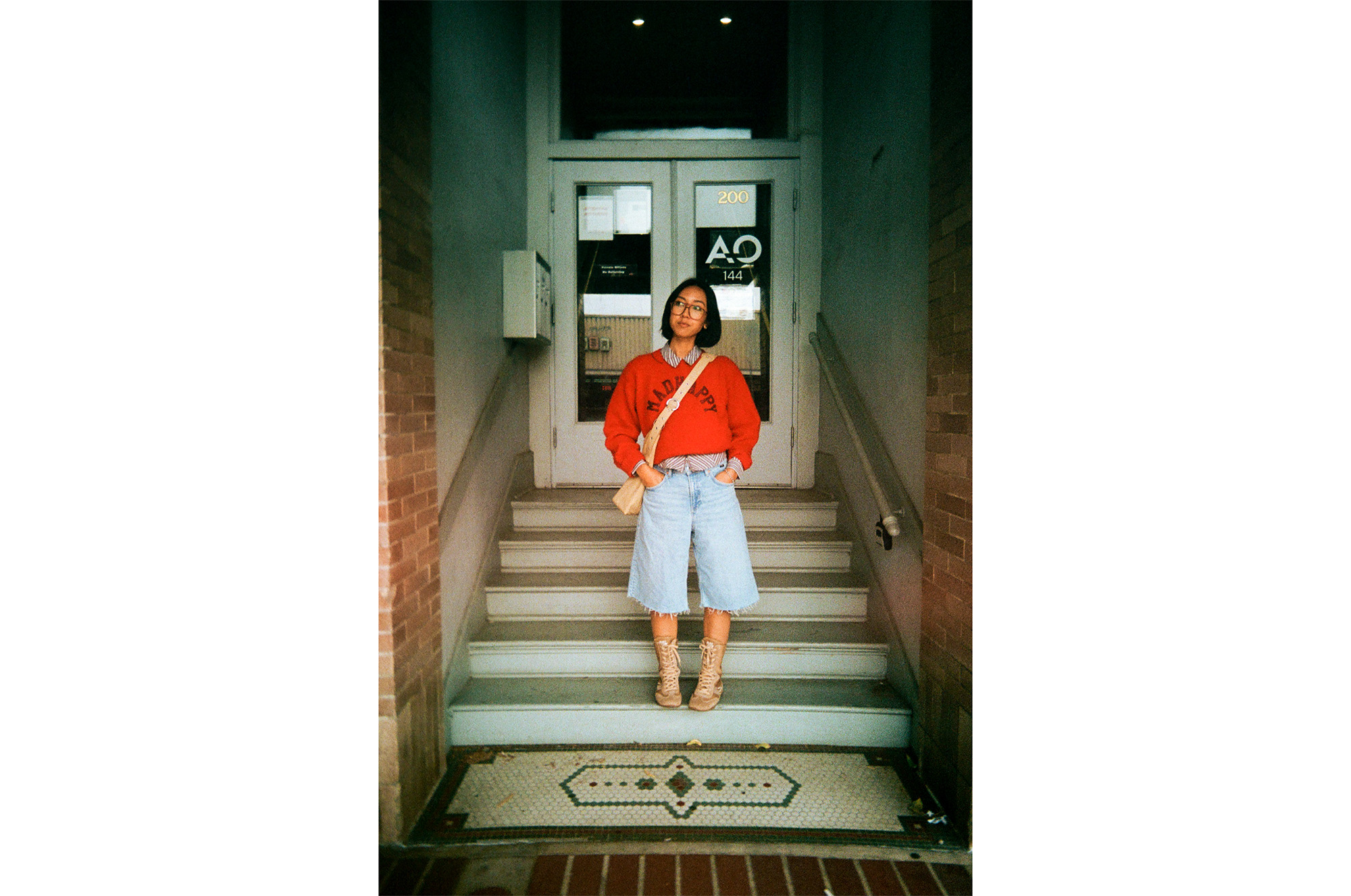 Reto Pano sample image of person stood on stairs wearing red top