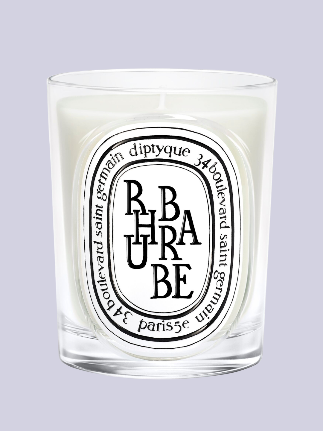 A rhubarb-scented candle from Diptyque in a glass vessel