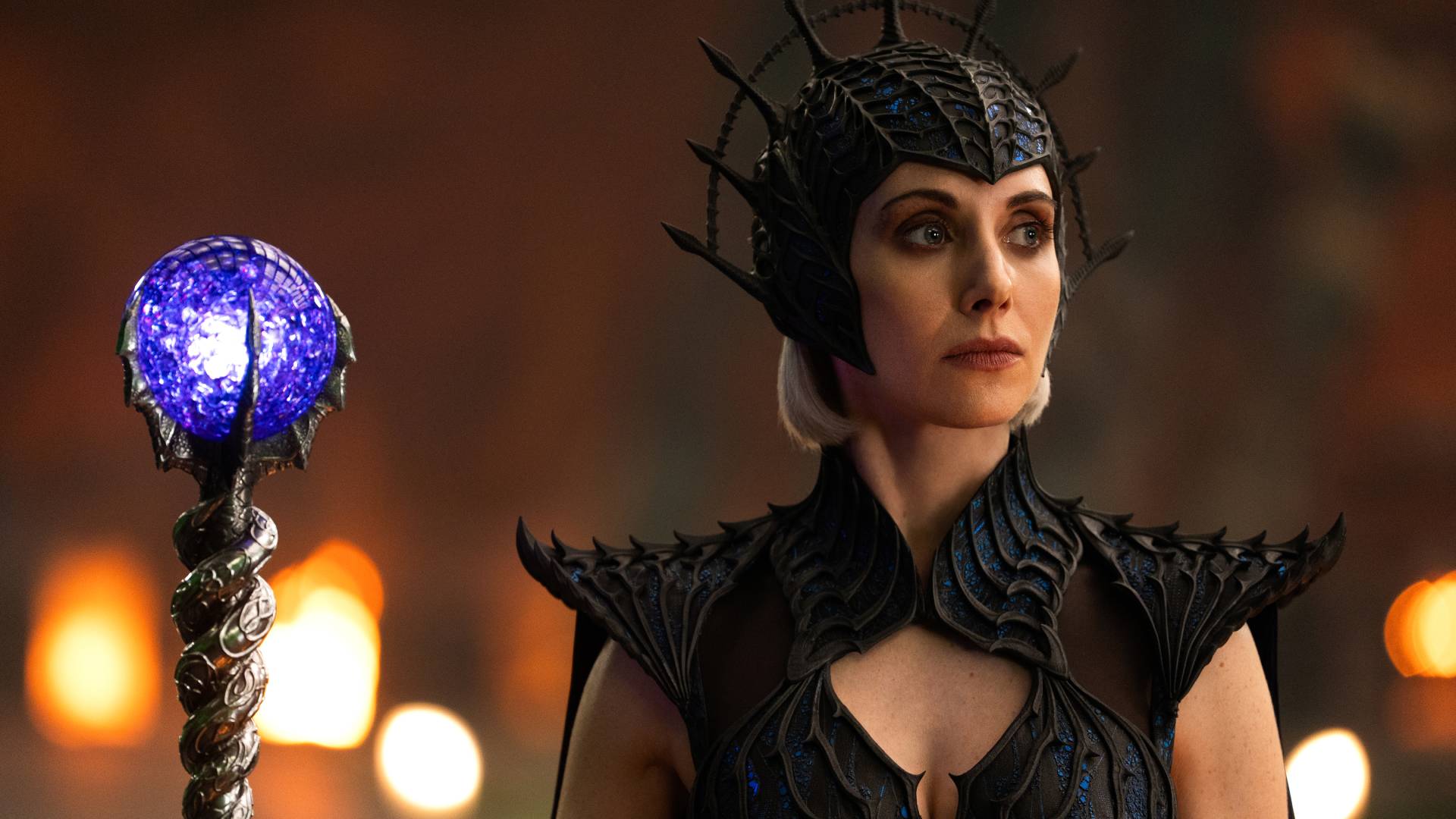Alison Brie as Evil-Lyn in Masters of the Universe, holding a magic staff