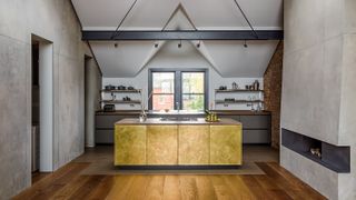 Gold kitchen cabinets with open shelving from Sola Kitchens