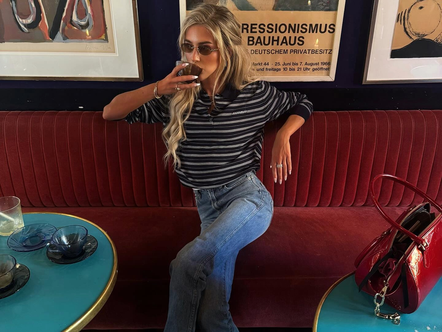 Emili Sindlev in a striped Miu Miu polo shirt.