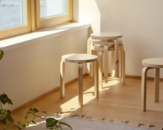 artek stools in a simple room
