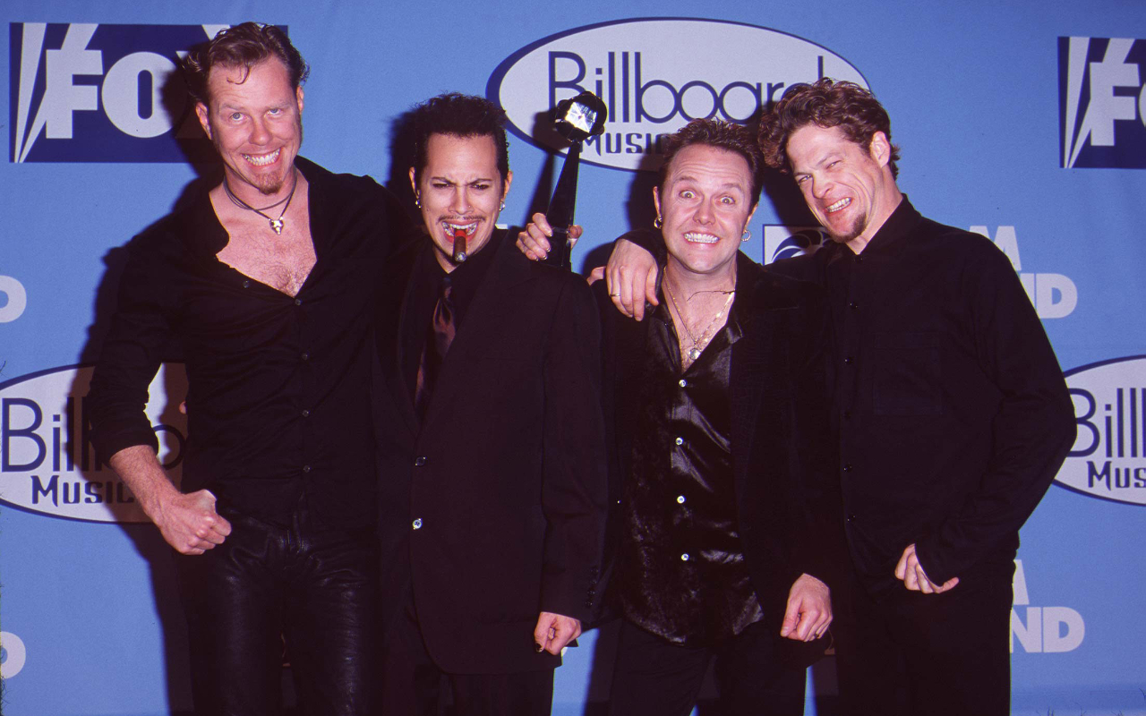 Metallica at a red carpet event pulling silly faces