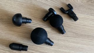 Lairlux massage gun heads laid out for testing