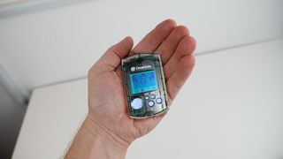 Holding a Sega Dreamcast VMU with Chao Adventure on it