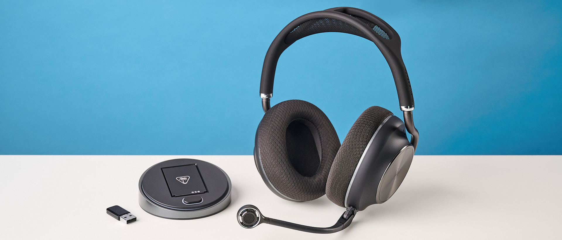 The Turtle Beach Stealth Pro II next to its base station and 2.4G dongle