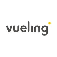A Vueling plane flying through the sky