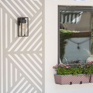 garden area with wall mounted plant pots