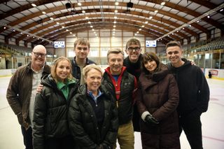 Jayne Torvill and Christopher Dean with some of the Emmerdale cast on an ice rink.