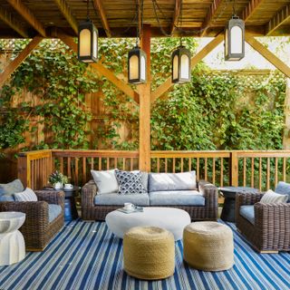 A back porch with cozy seating and lots of cushions