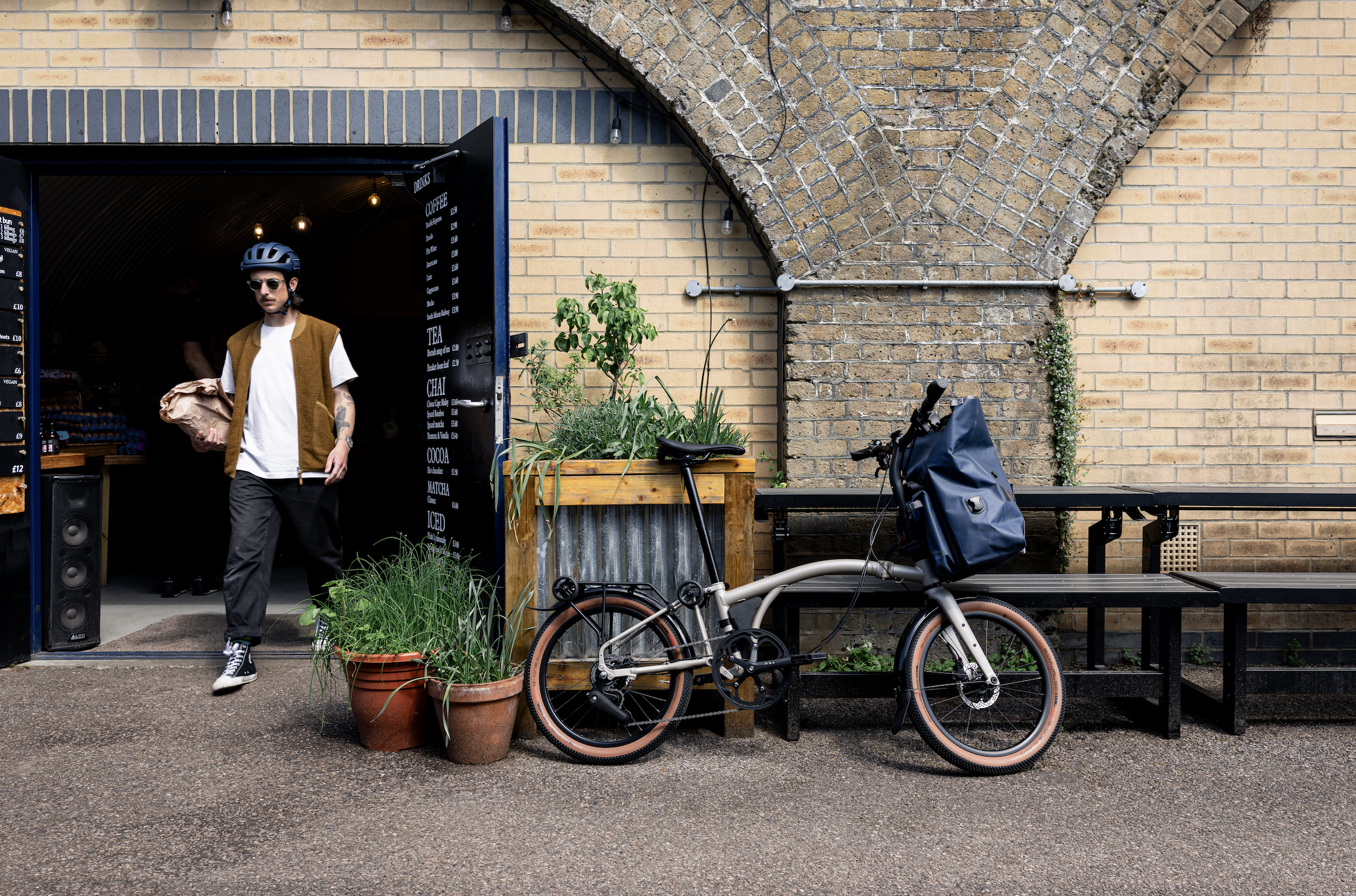 A trendy-looking man with a Brompton bike