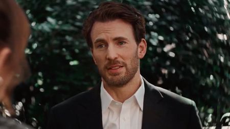 Chris Evans wearing a blazer and collared shirt in Materialists