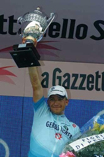 A cup and some flowers... reward for Robert F&ouml;rster's stage 21 win