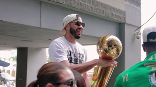 Jayson Tatum holding an NBA championship trophy in a still from Starting 5