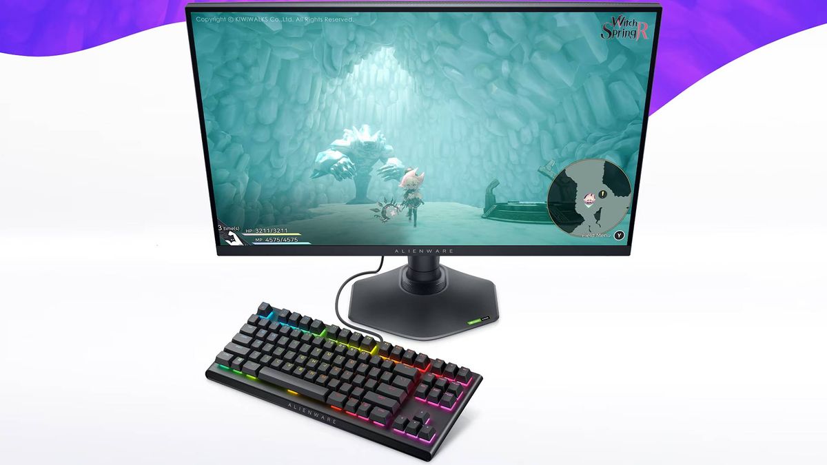 Alienware AW2724DM gaming monitor next to RGB keyboard with white background and purple accents with Witch Spring R gameplay on screen.