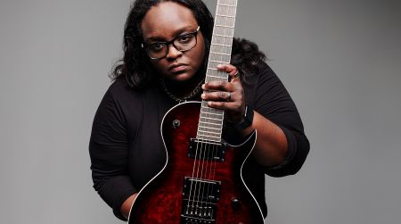 Diamond Rowe, co-founder and lead guitarist for Tetrarch, poses with her Jackson Pro Series Signature Diamond Rowe Monarkh DR12MG