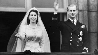 Princess Elizabeth and Prince Philip, Duke of Edinburgh waving to a crowd from the balcony of Buckingham Palace, London, shortly after their wedding at Westminster Abbey, 20th November 1947.