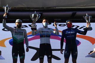 ROQUETAS DE MAR SPAIN FEBRUARY 14 Podium Martin Laas of Estonia and Team BORA hansgrohe Giacomo Nizzolo of Italy and Team Team Qhubeka Assos Florian Senechal of France and Team Deceuninck QuickStep Celebration during the 34th Clsica de Almeria 2021 a 1833km race from Pueblo de Vicar to Roquetas de Mar Trophy Mask Covid Safety Measures ClasicaAlmeria21 on February 14 2021 in Roquetas de Mar Spain Photo by Tim de WaeleGetty Images