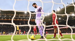 Liverpool goalkeeper Alisson Becker looks dejected after conceding in the Reds' 3-0 defeat to Wolves in the Premier League in February 2023.