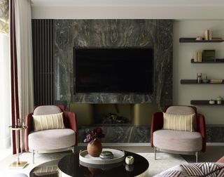 Small living room with marble wall disguising the TV