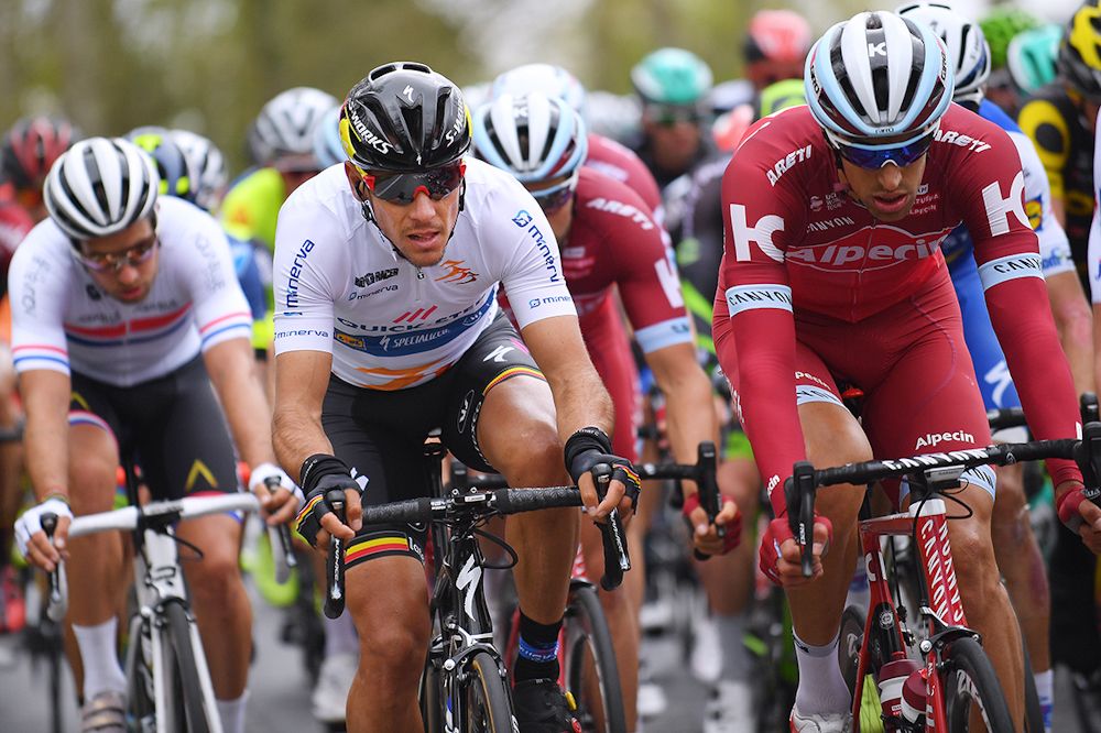 Philippe Gilbert in the leader's jersey rides in the Three Days of De Panne bunch