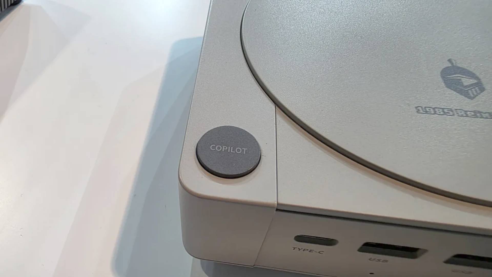 Close up of Acemagic Retro mini PC Copilot button.