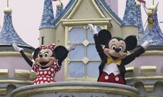 Mickey Mouse and Minnie Mouse perform during a parade at Hong Kong Disneyland on Sept. 11, 2005.