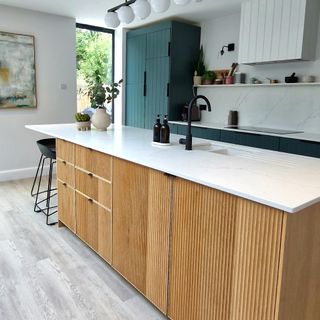 kitchen island with fluted wood front