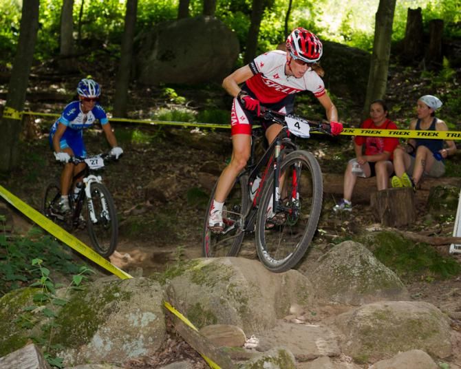 Lea Davison followed closely by Katerina Nash through the Fire Lane rock drop